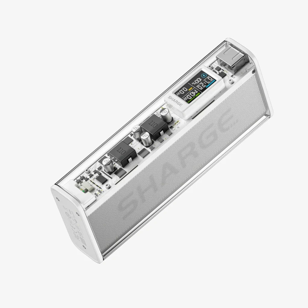 Power Bank Shargeek 140 plata con carcasa transparente, pantalla LED con datos de carga, puertos USB-C y USB-A, diseño rectangular y bordes pulidos